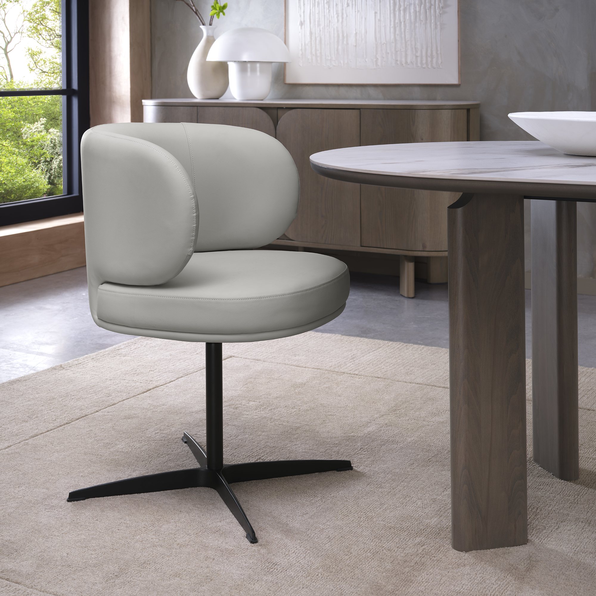 Marcel - 360° Swivel Chair in a Light Grey Faux Leather with Black Legs