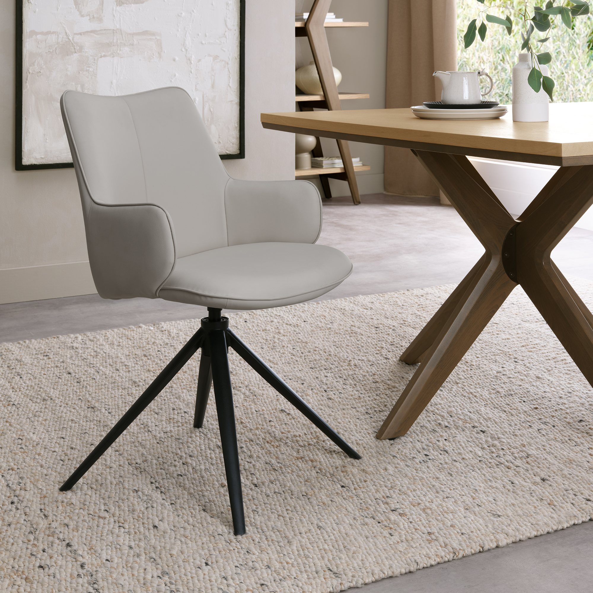 Rowan - 360° Self Returning Swivel Chair in a Light Grey Faux Leather with Black Legs