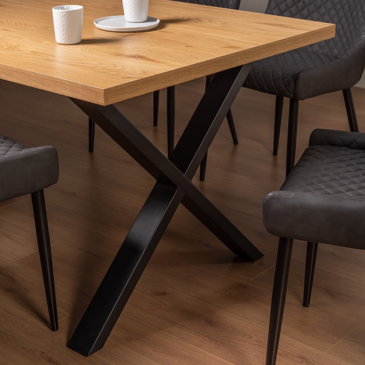Ramsay - X Leg Oak Effect 6 Seater Dining Table & 6 Dark Grey Faux Leather Cezanne Dining Chairs