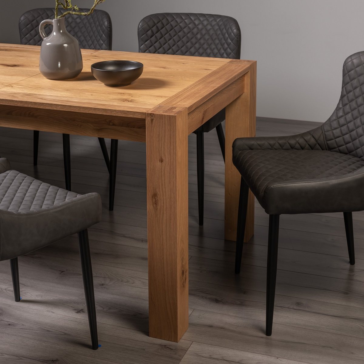 Blake - Light Oak 8-10 Seater Extendable Table & 8 Grey Faux Leather Cezanne Dining Chairs