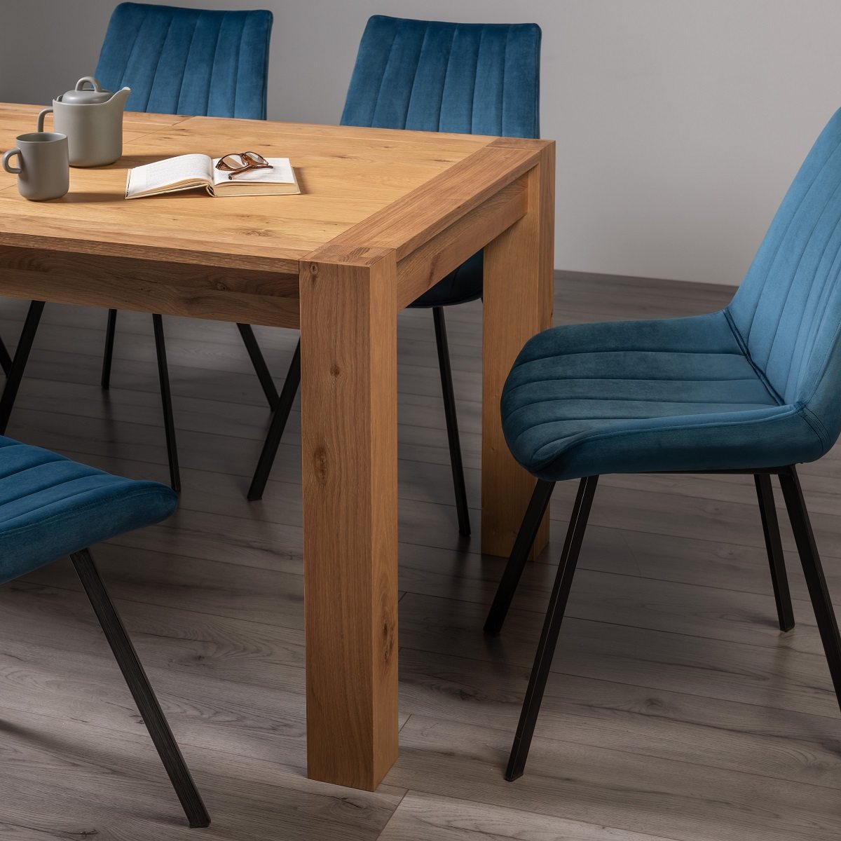 Blake - Light Oak 8-10 Seater Extendable Dining Table & 8 Blue Velvet Fontana Dining Chairs