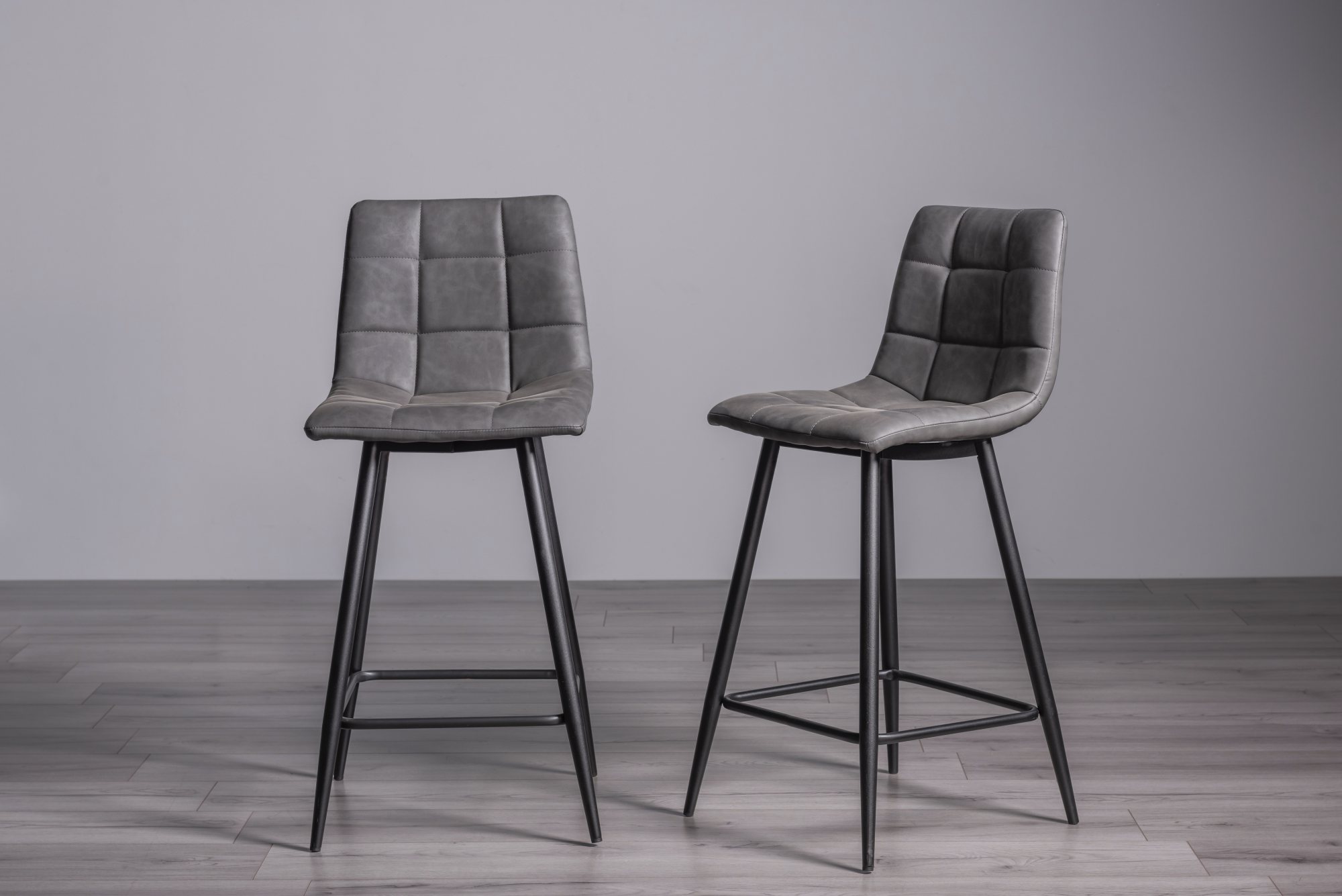 Mondrian Dark Grey Faux Leather Bar Stools with Black Legs