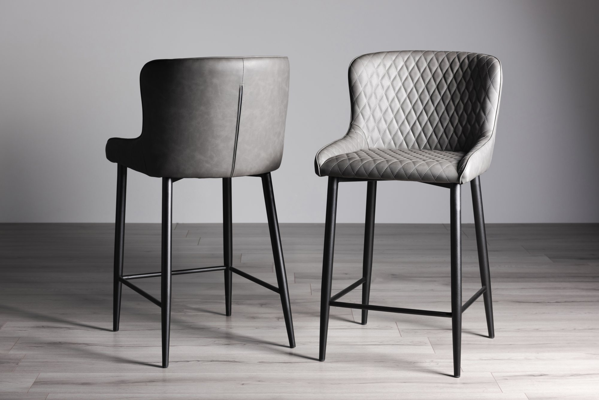 Cezanne Dark Grey Faux Leather Bar Stools with Black Legs