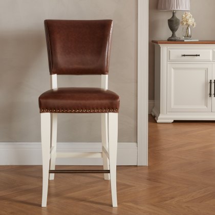 Rivera Ivory Bar Stools in a Rustic Tan Faux Leather