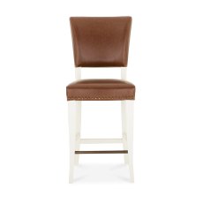 Rivera Ivory Bar Stools in a Rustic Tan Faux Leather