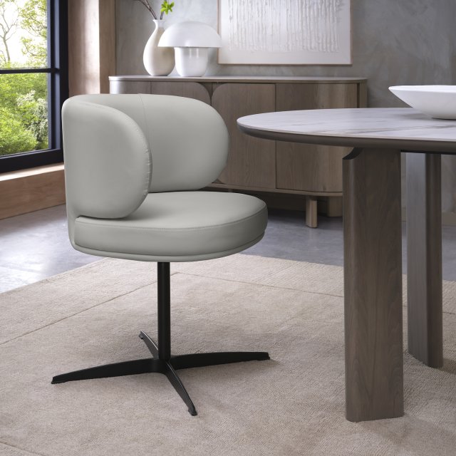Marcel Swivel Dining Chair in a Light Grey Faux Leather (Pair) Marcel Swivel Dining Chair in a Light Grey Faux Leather (Pair)