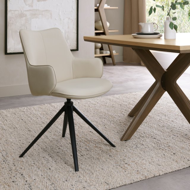 Rowan Self Returning Swivel Chair in a Ivory Faux Leather Rowan Self Returning Swivel Chair in a Ivory Faux Leather