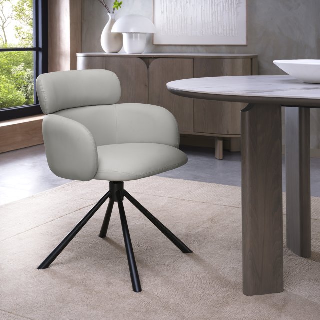 Hudson Self Returning Swivel Chair in a Light Grey Faux Leather Hudson Self Returning Swivel Chair in a Light Grey Faux Leather